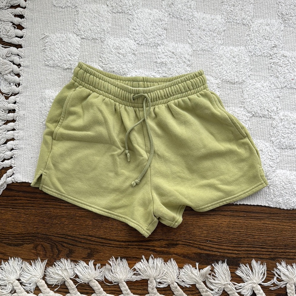 Green sweatpants shorts